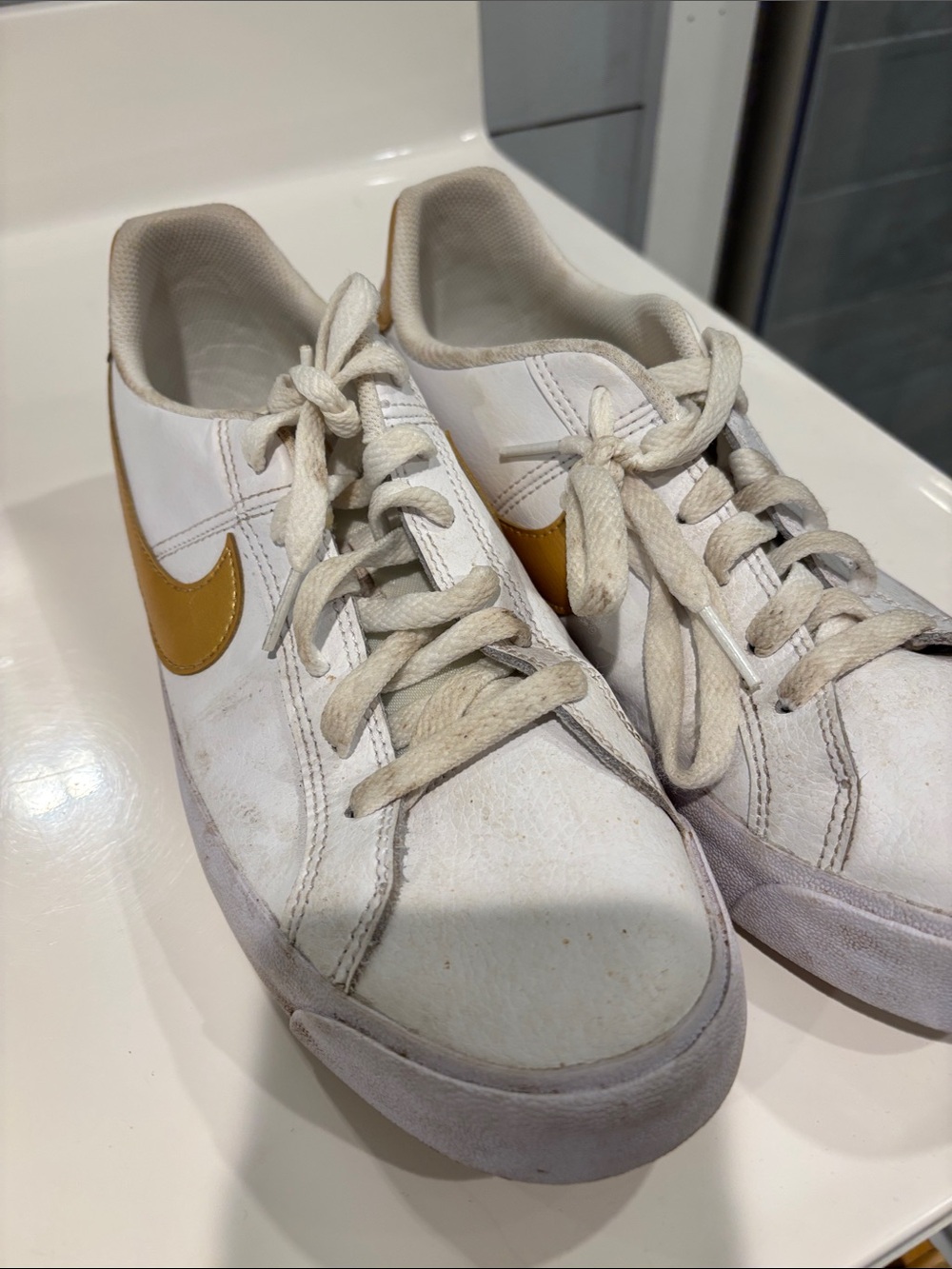 Nike White Low-Top Sneakers with Yellow Swoosh